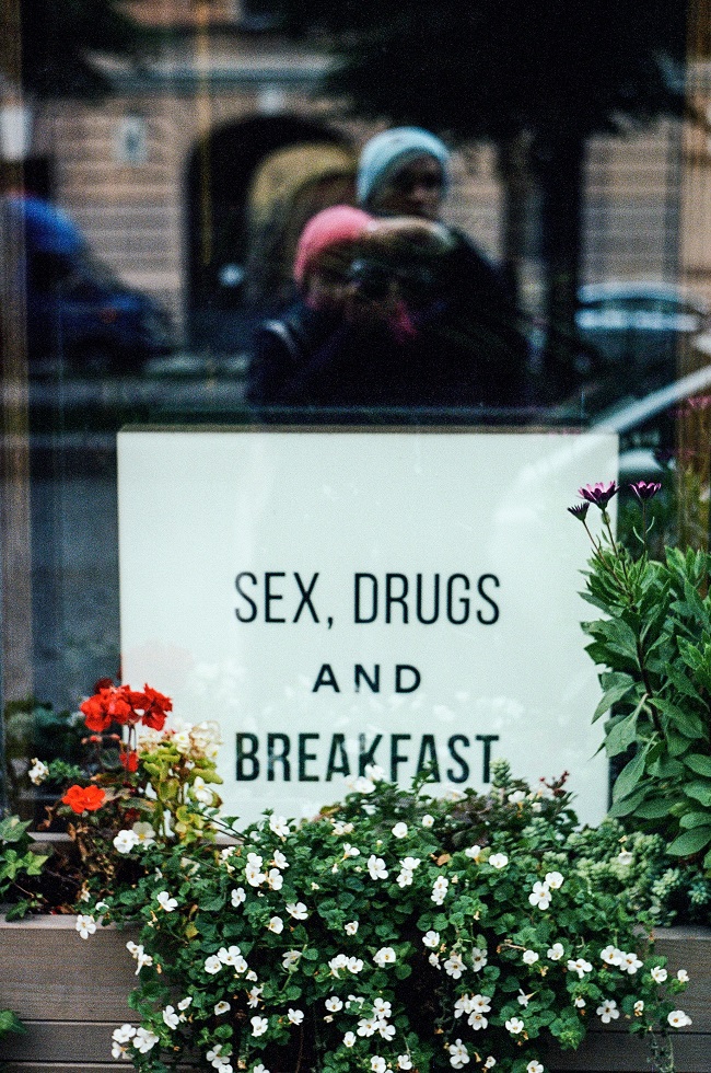 business sign states sex drugs and breakfast