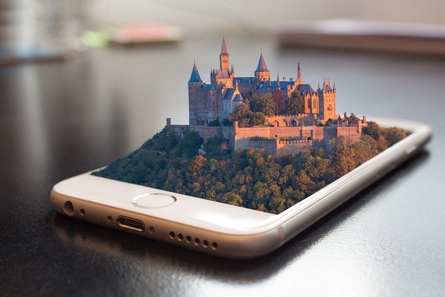 photo of a castle placed within a mobile phone screen