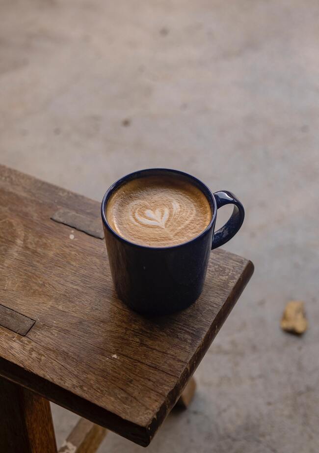 mug of coffee on a bench