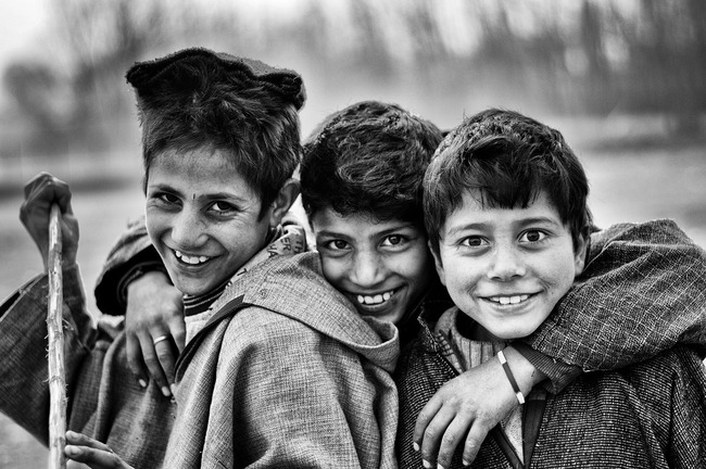 three boys smiling