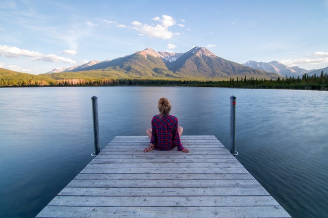 woman sitting end jetty